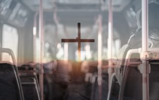 cross image superimposed in the center of a bus