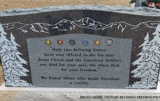 Large stone memorial installed on a government-run property at Monument Cemetary, CO bearing all military branch insignia with the inscription “Only two defining forces have ever offered to die for you, Jesus Christ and the American soldier. One died for your soul, the other died for your freedom. We honor those who made freedom a reality.”
