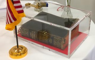 Bible padlocked in a plexiglass box on MIA/POW table at Manchester VA facility