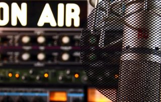 Radio microphone with on air sign in background