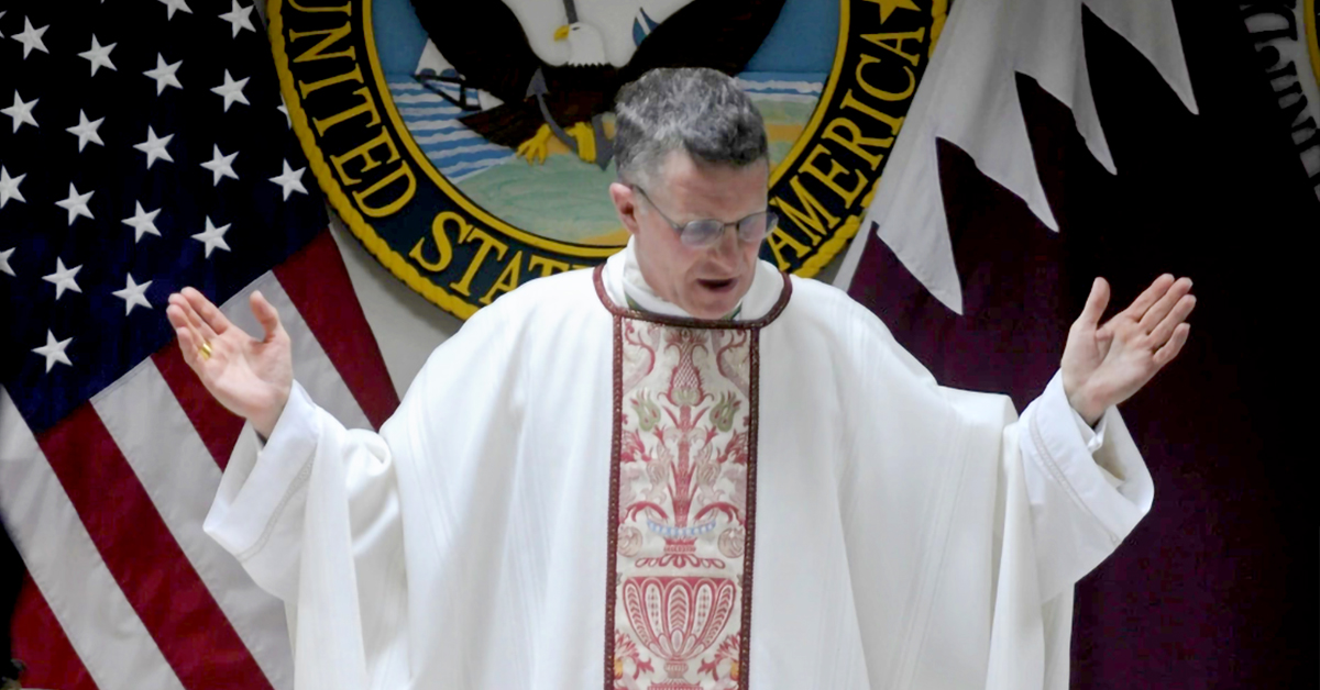 Arch Bishop of Military Services Timothy Broglio in Arch Bishop robes with hands raised in prayer