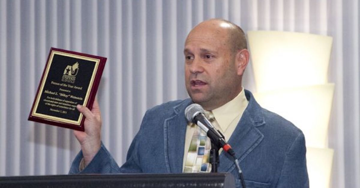 2011 photo of Mikey Weinstein receiving Americans United Person of the Year award