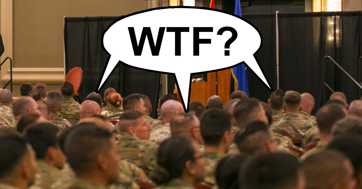 Audience of soldiers with balloon above their heads saying WTF