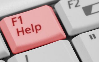 Part of computer keyboard with help button highlighted