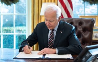 President Biden signing a bill