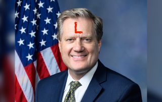 Representative Mike Turner with big red letter L on his forehead for loser