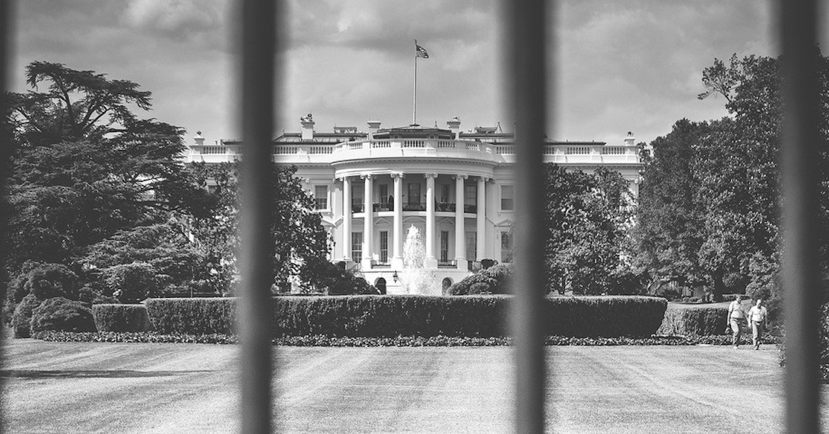 View of White House looking through bars of fence