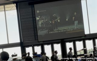 New Life Church worship service playing on huge TV screen in Air Force Academy dining hall