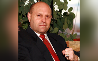 Photo of Mikey with fist raised