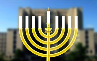Graphic of a menorah in front of VA Medical Center blurred in background