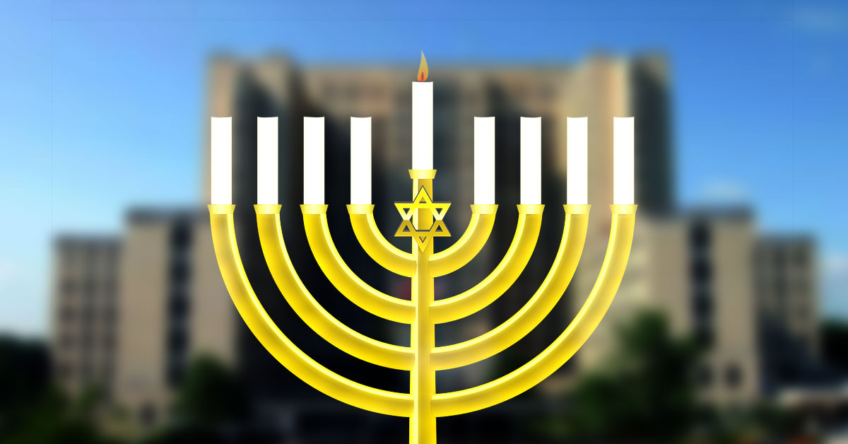 menorah Graphic of a menorah in front of VA Medical Center blurred in background
