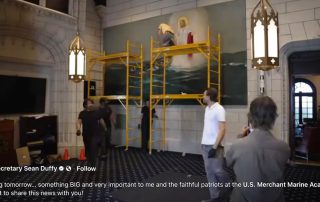 Still image from Duffy's video of giant Jesus painting being rehung