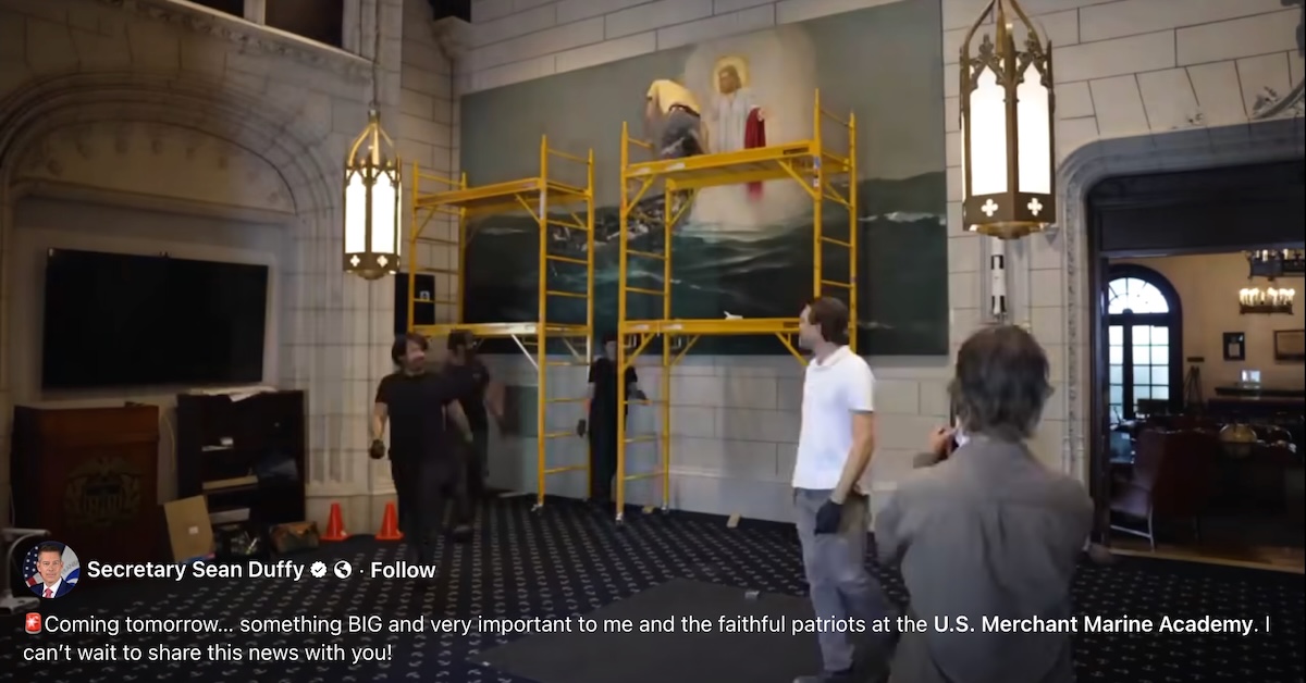 Still image from Duffy's video of giant Jesus painting being rehung