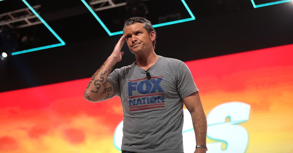 Pete Hegseth on stage wearing Fox News t-shirt