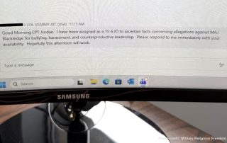 Photo of Captain Jordan's computer with message on screen saying the investigation has been reopened