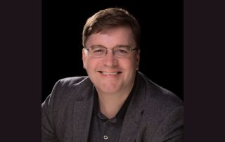 MRFF Advisory Board Member Jonathan Larsen headshot against a black background